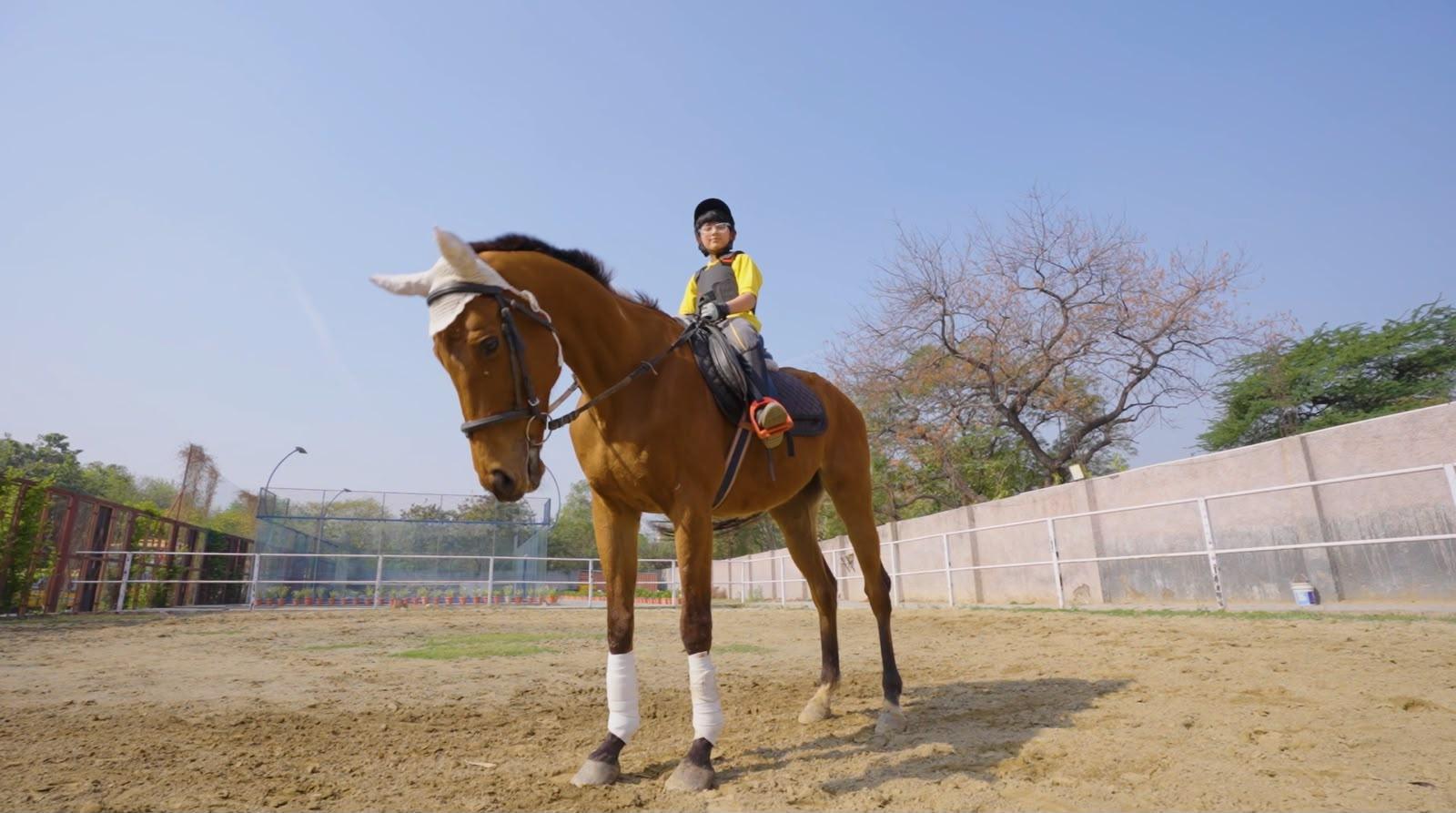 student riding a horse